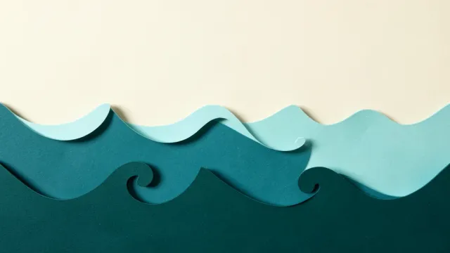 Layered paper-craft ocean waves in a teal gradient depth